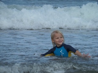 boy playing in ocean